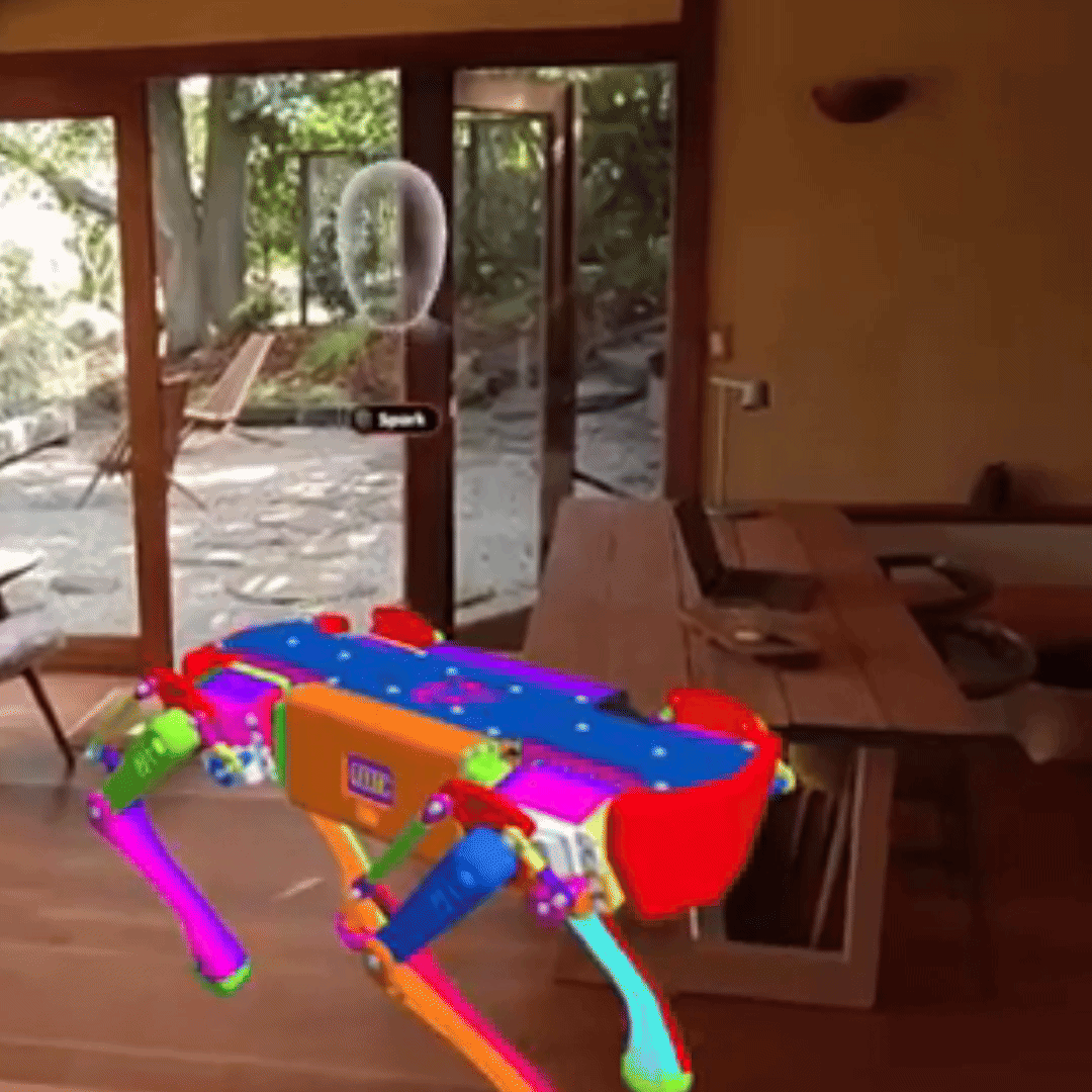 Campfire avatar Spark waving inside an AR scene with a colorful 3D model on a table