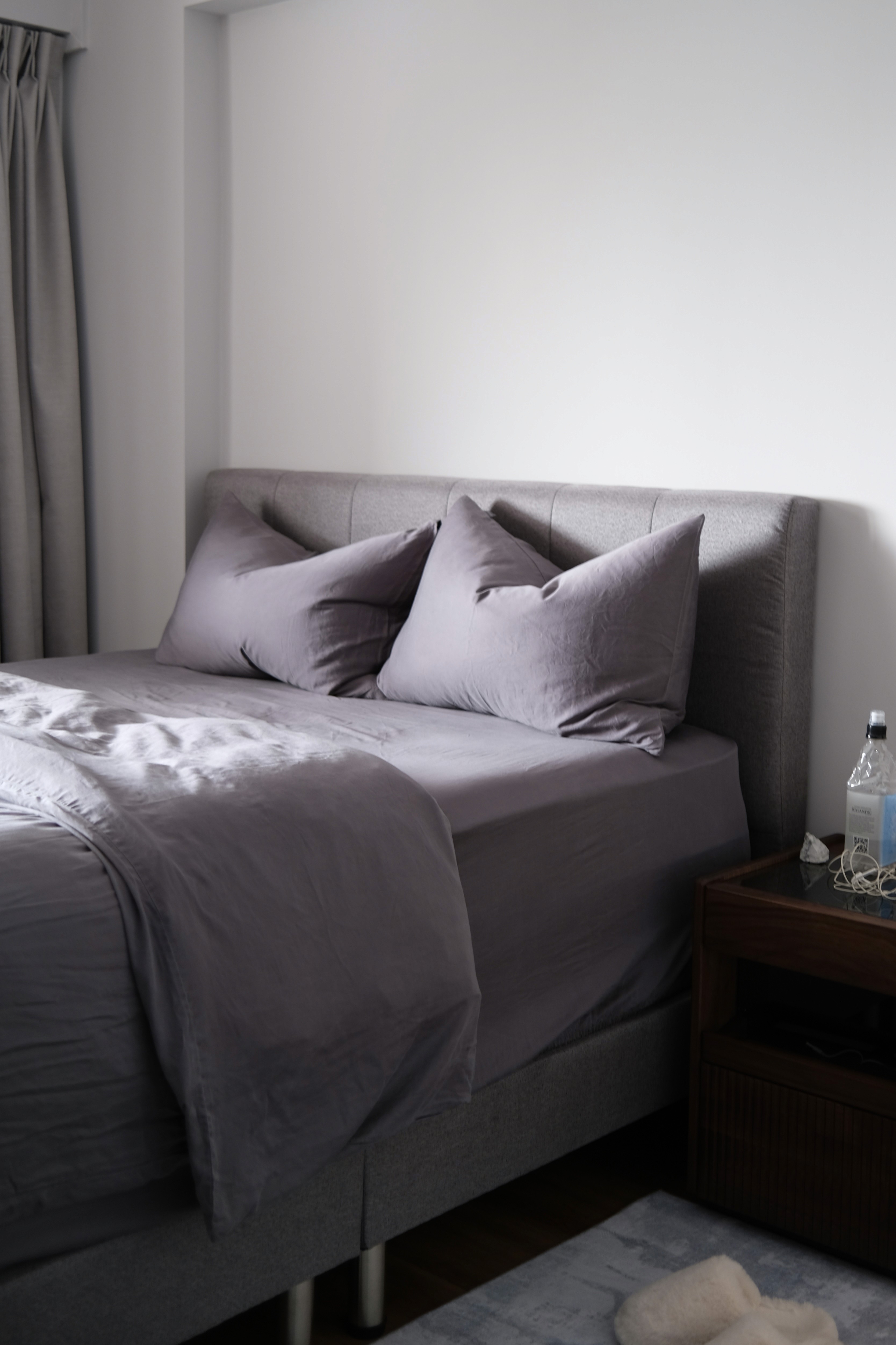 Calm and pared back, the bedroom is a place to slow down, wrapped in soft greys and gentle textures that favour rest over excess.