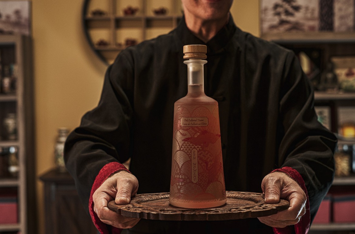 A couple stands closely in an intimate embrace.