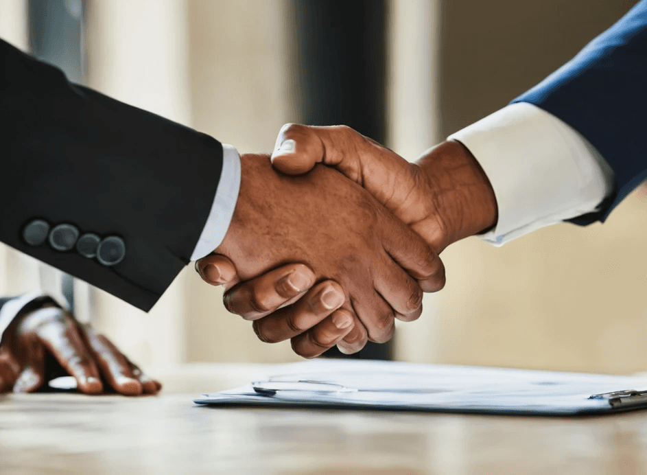 Two business leaders shaking hands