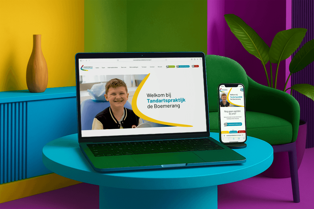 Aerial view of a winding road cutting through rocky terrain and sandy landscape.