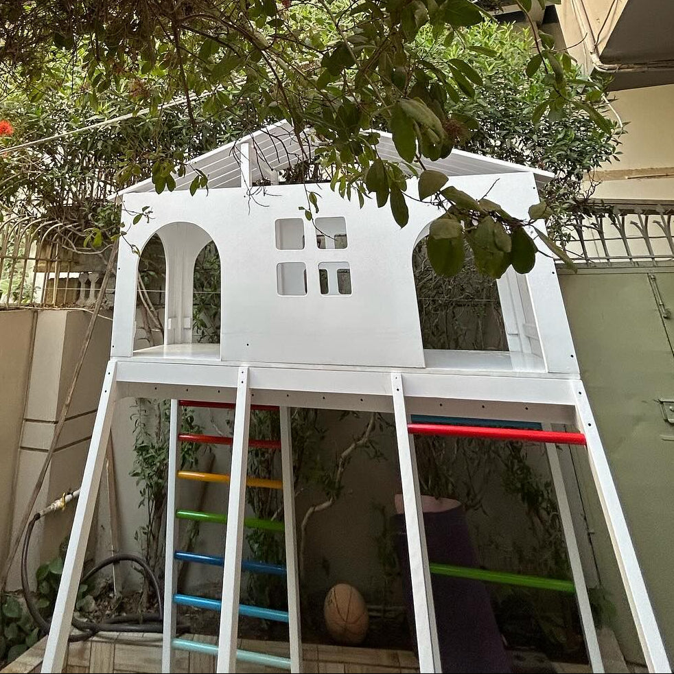 White playhouse with ladder and slide 