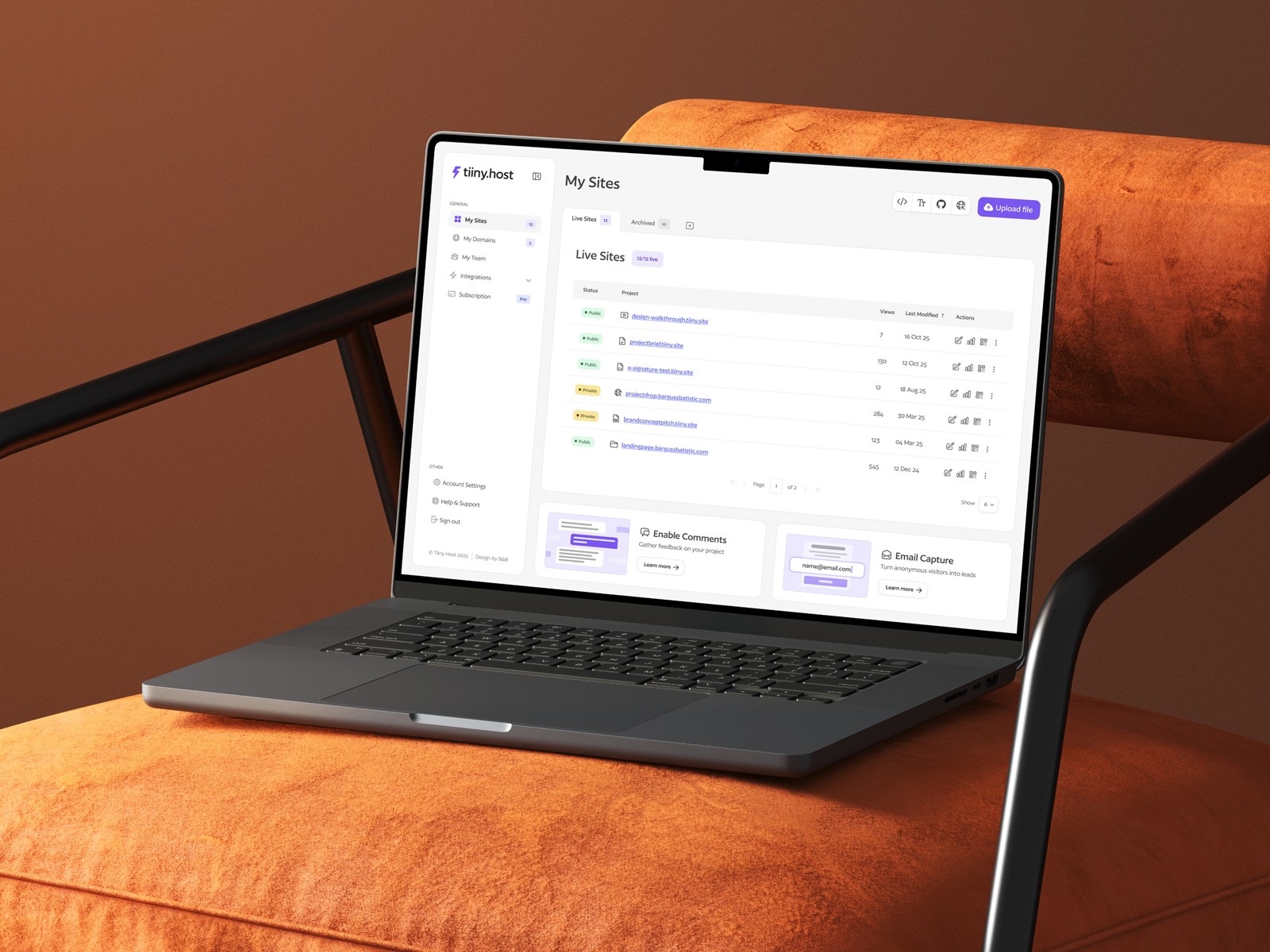 Laptop placed on a chair displaying a user dashboard with a list of projects