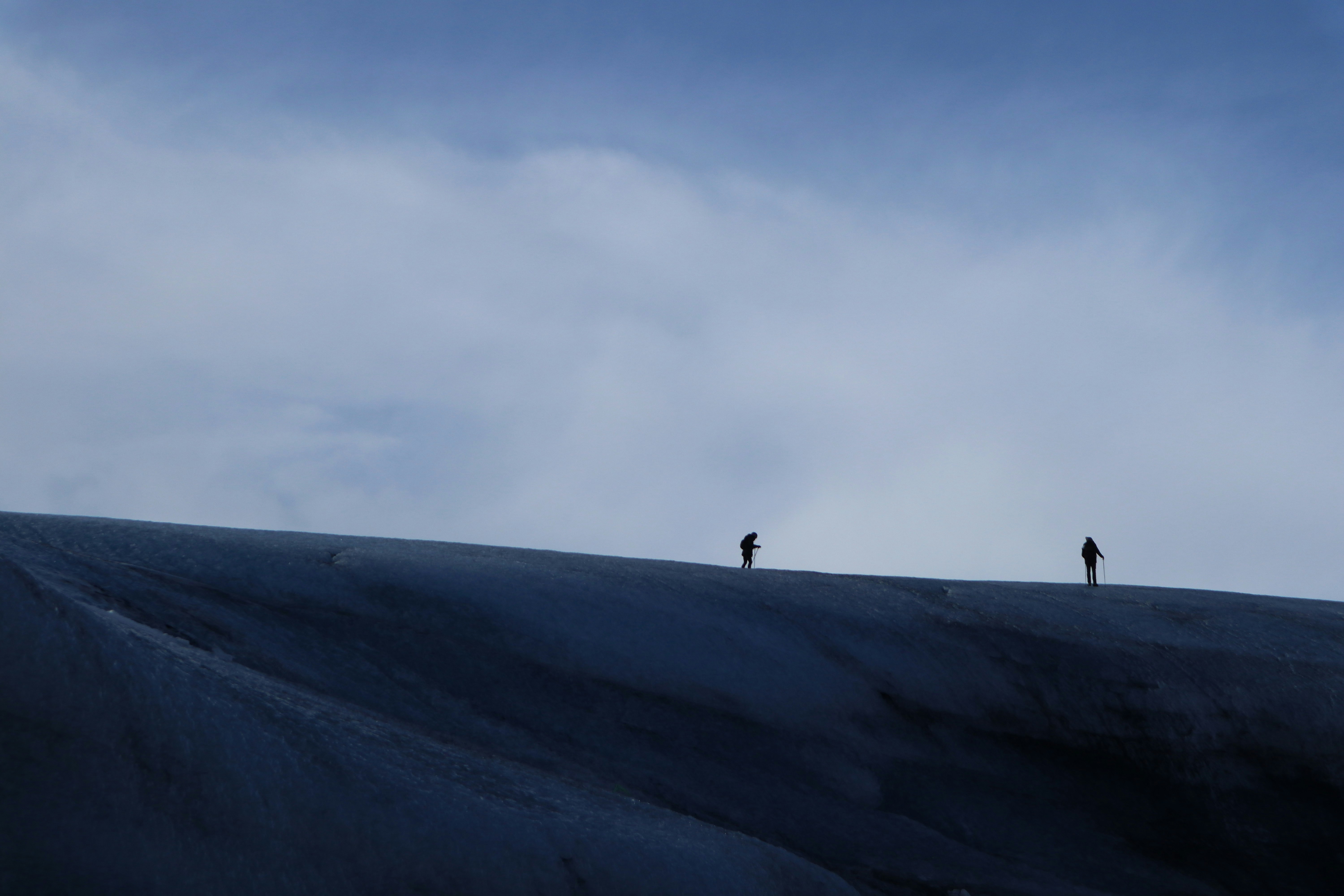 A couple glacier hiking in Iceland.