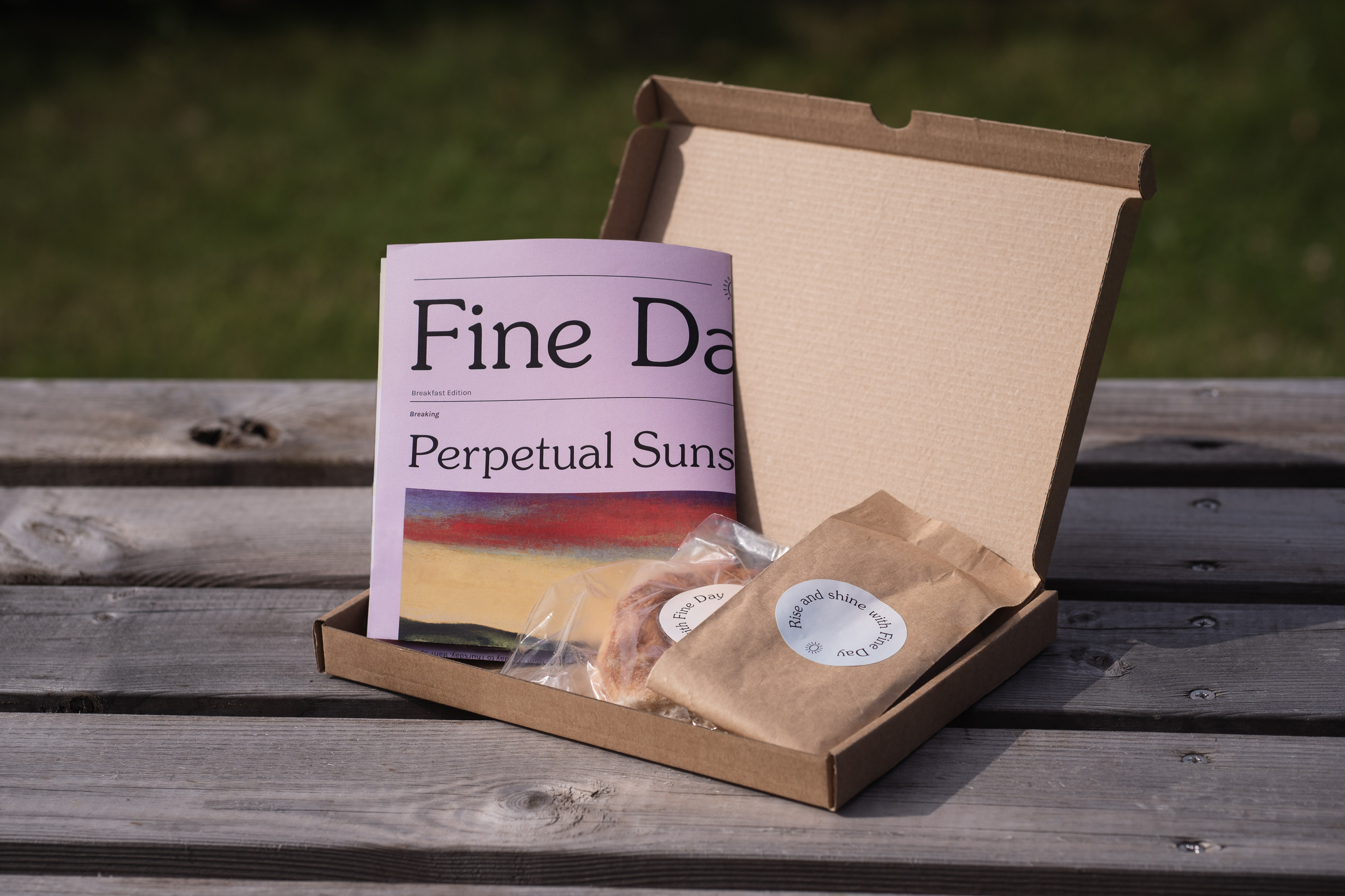 a breakfast pack with newspaper, ground coffee and an Aberdeen rowie