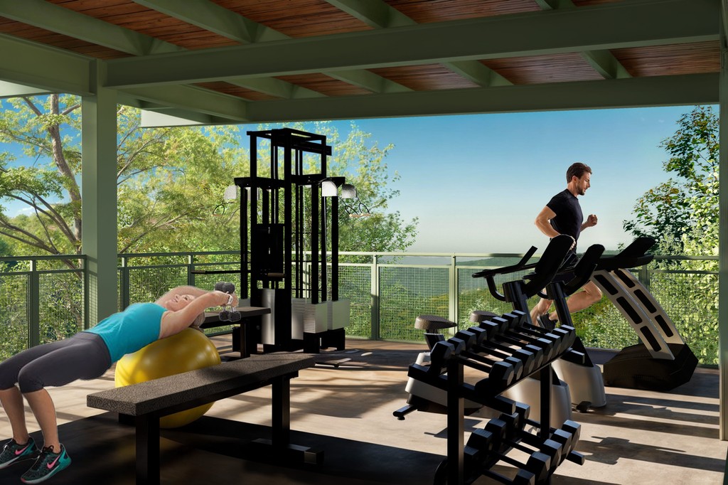 render del gimnasio de yuniko cottage & lake con dos personas ejercitandose