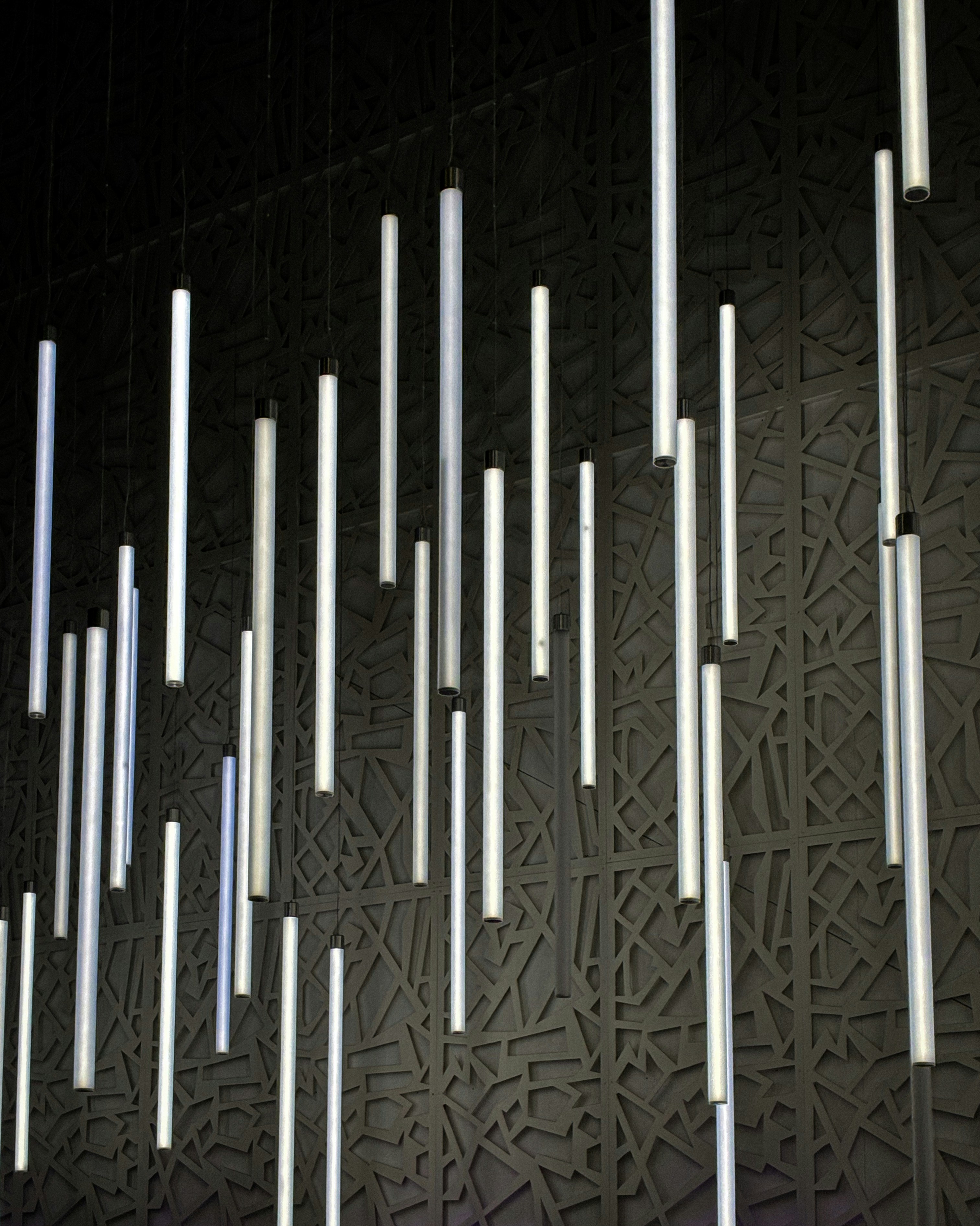 tube lights against textured wall riyadh, ksa by tawridat al hadaf