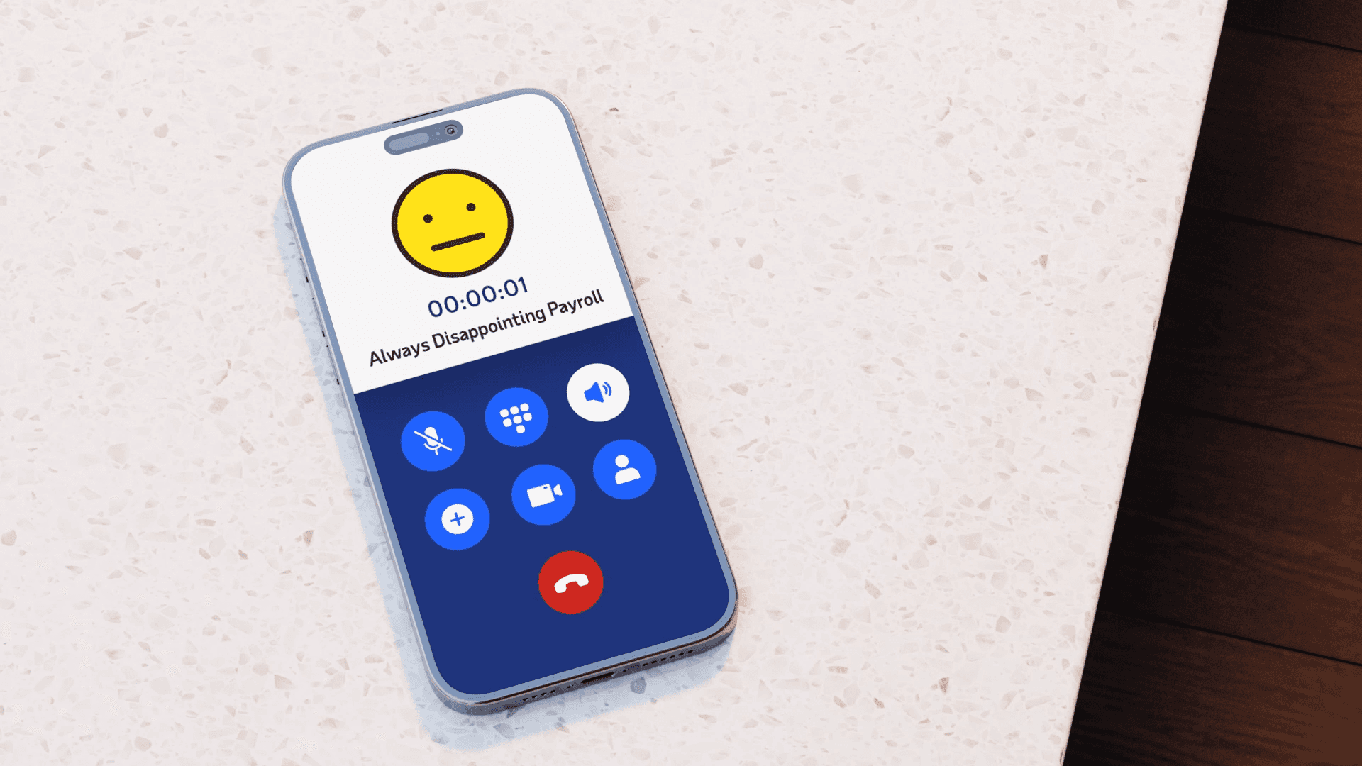 Phone on a counter showing a call from ‘Always Disappointing Payroll’ with a neutral emoji.