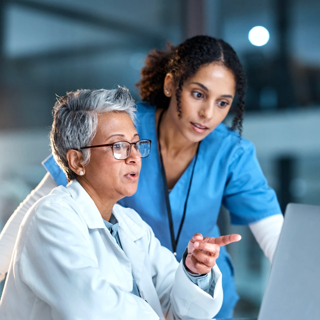 Nurse and doctor reviewing clinical standards