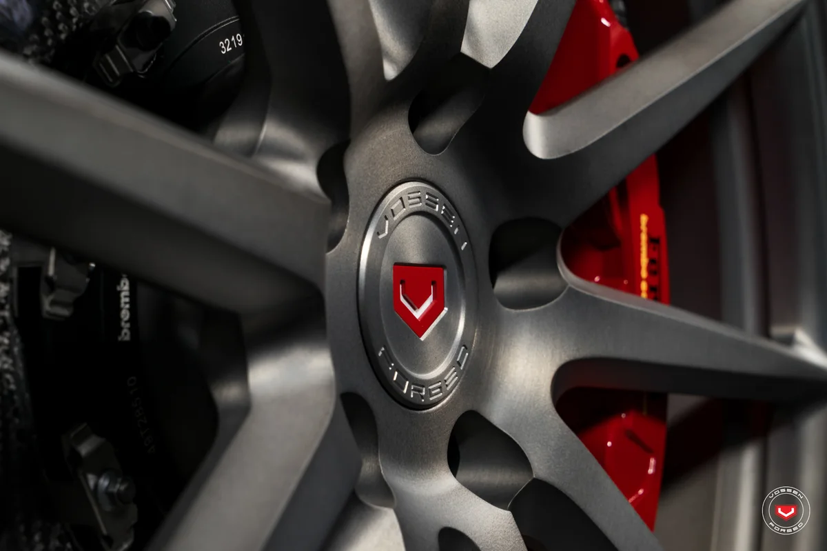 Vossen forged wheel detail with red calipers