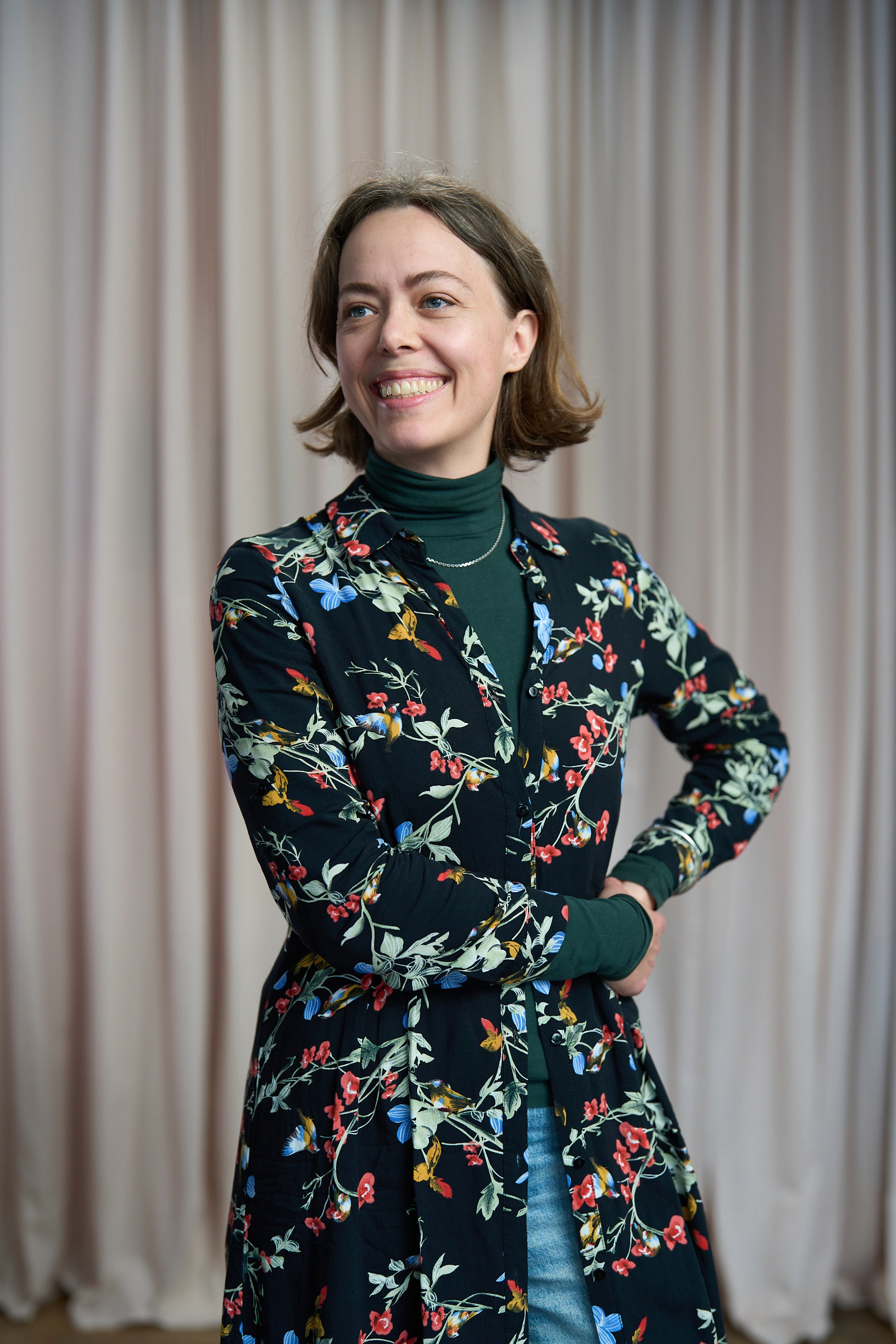woman standing beside wall