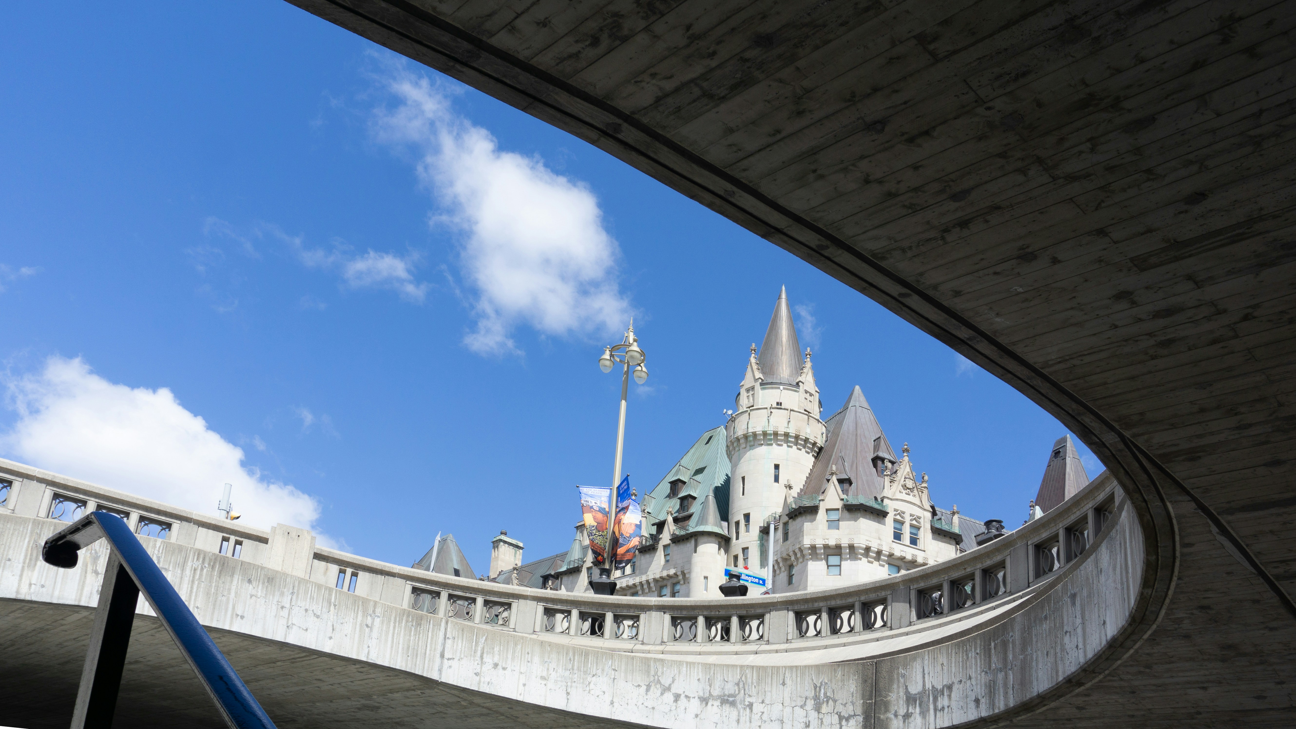 A view of a castle from under a bridge