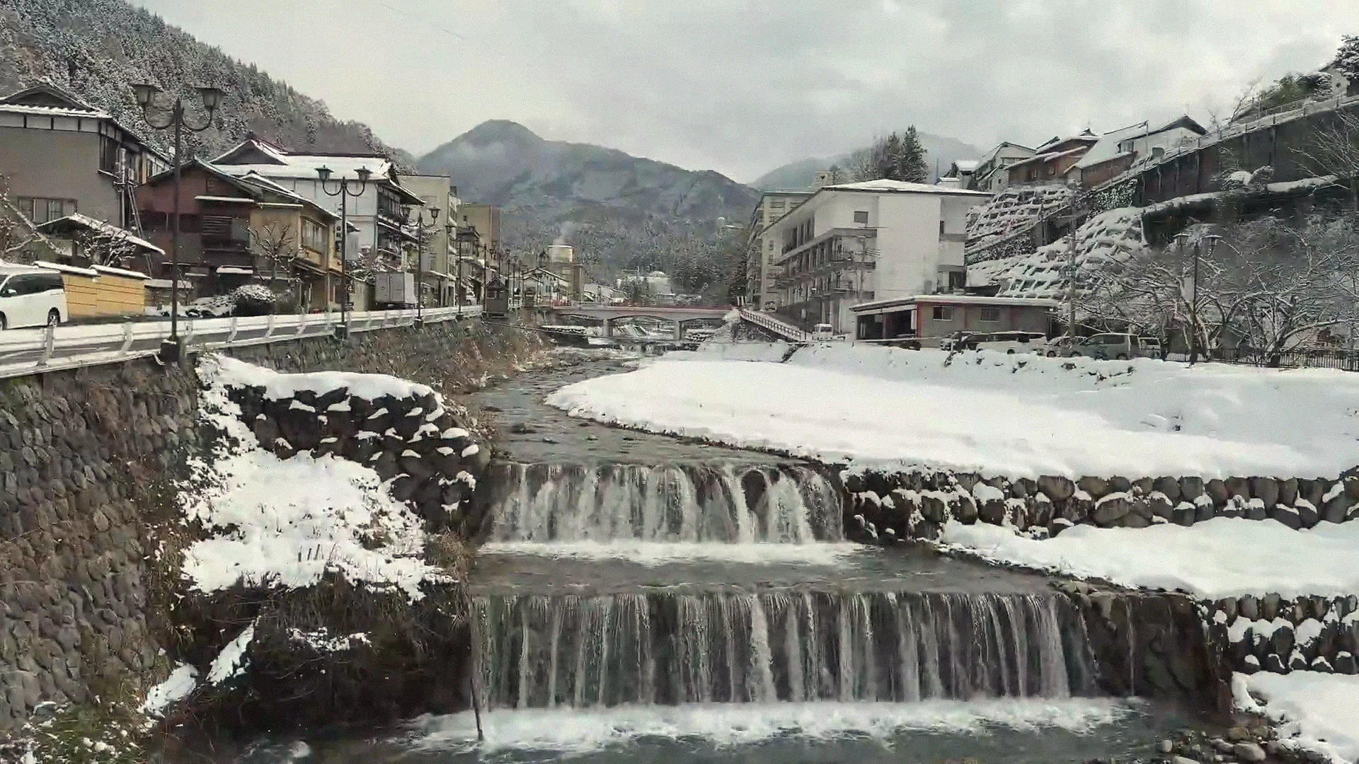 Onsen village along a river in the Nagano valley in winter