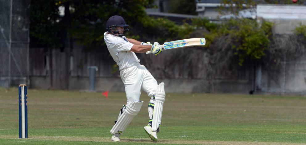 man in white shirt and brown pants wearing brown cowboy hat standing on green grass field