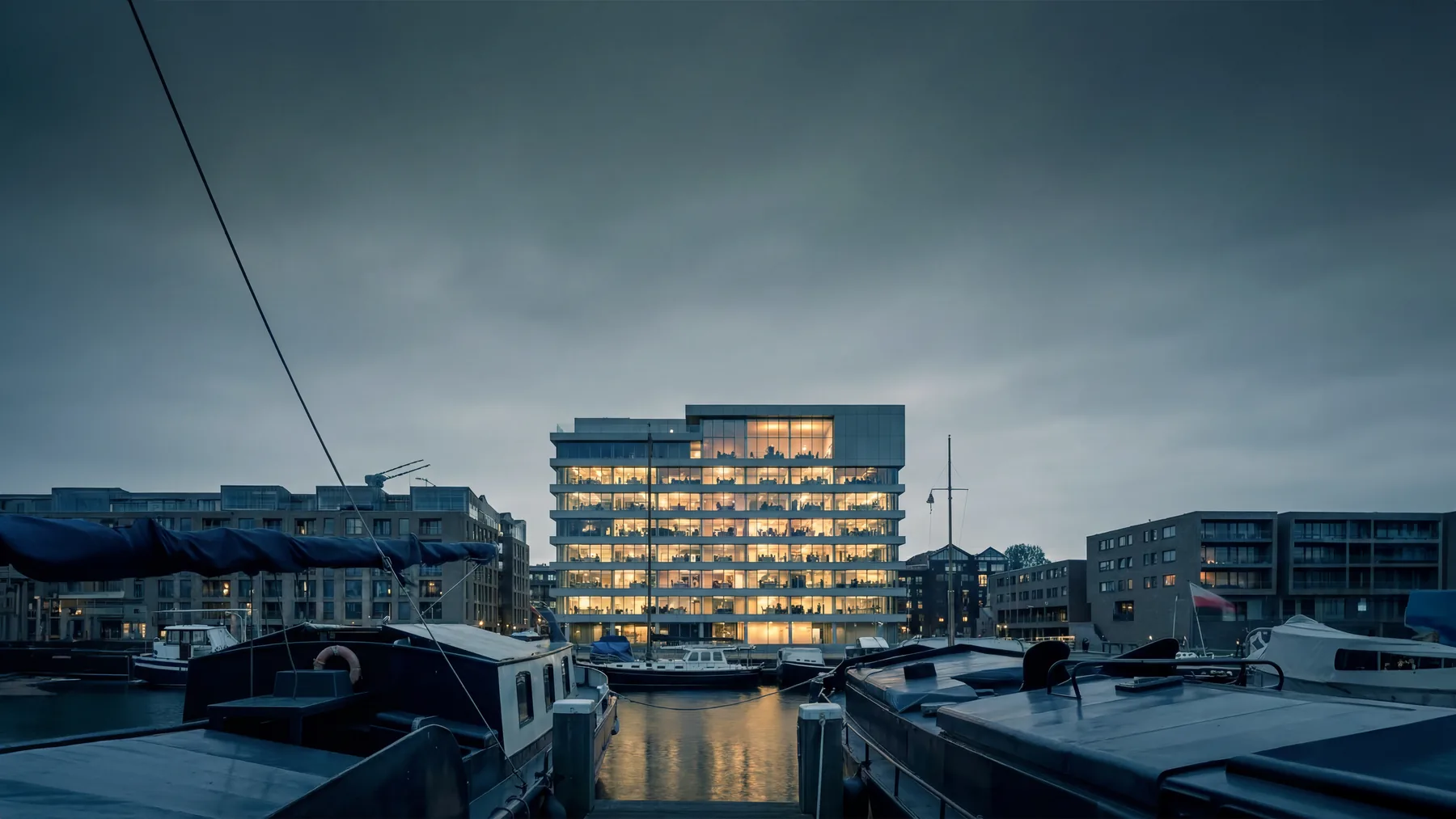 Mixed-use waterfront building on the IJ — WALVIS Amsterdam by KAAN Architecten