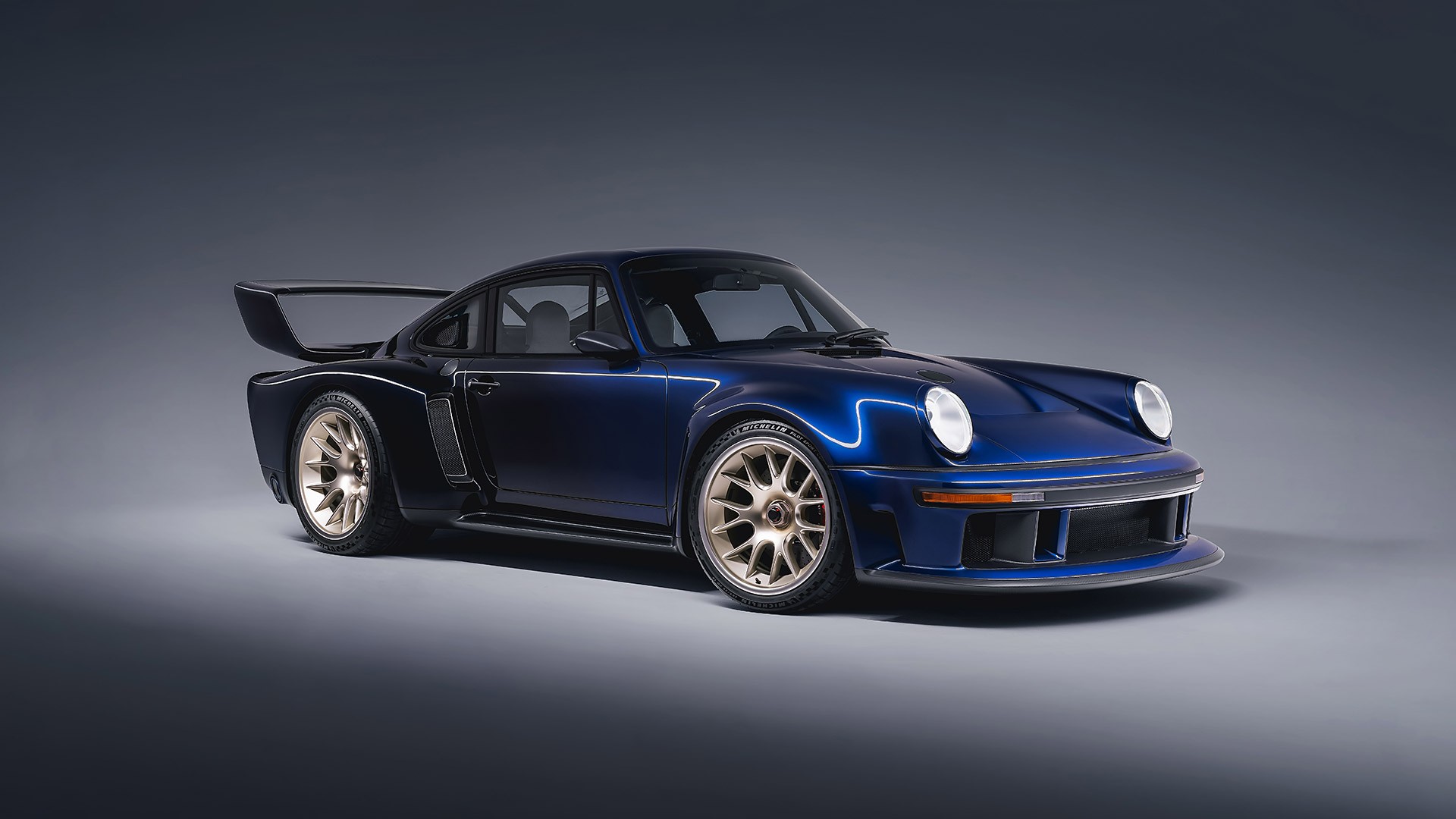 woman holding a phone and man looking at the phone. both are smiling