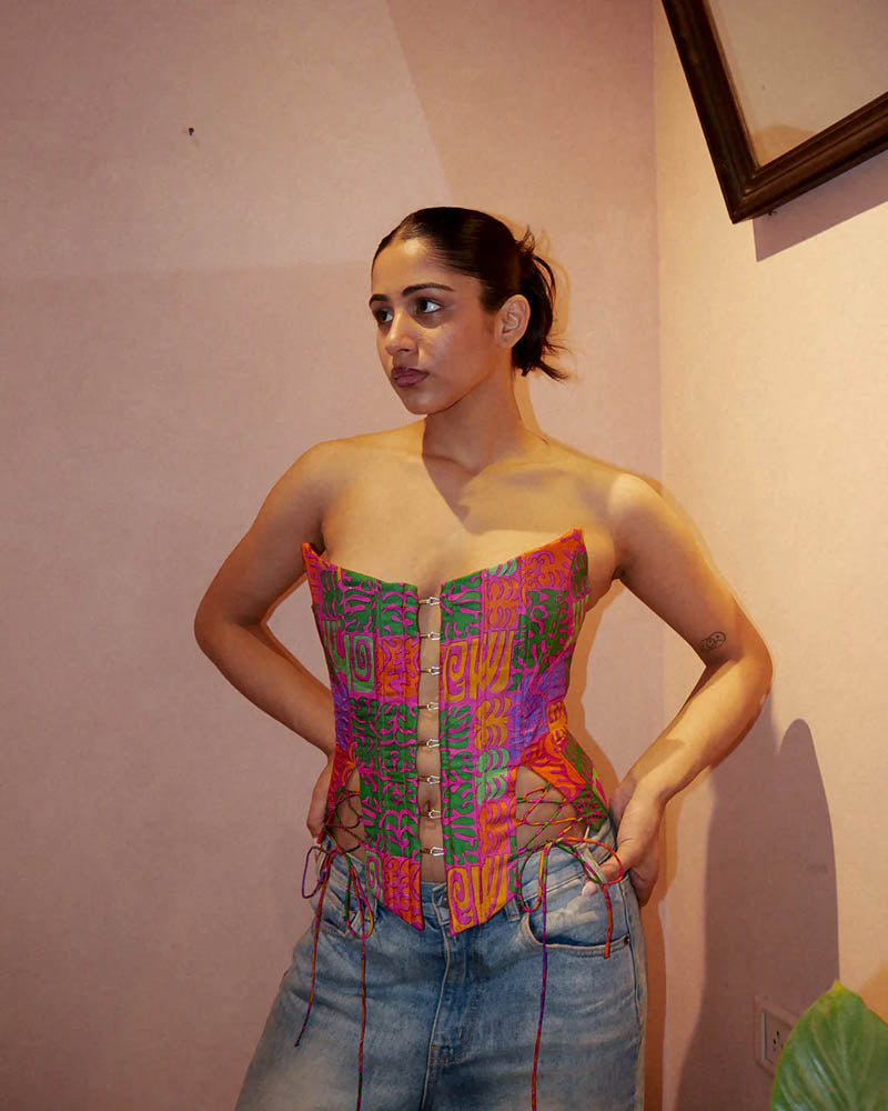 Raina four-panel corset handcrafted from vintage silk saree with structured silhouette, V-cut front, and lace-up panels for adjustable fit.