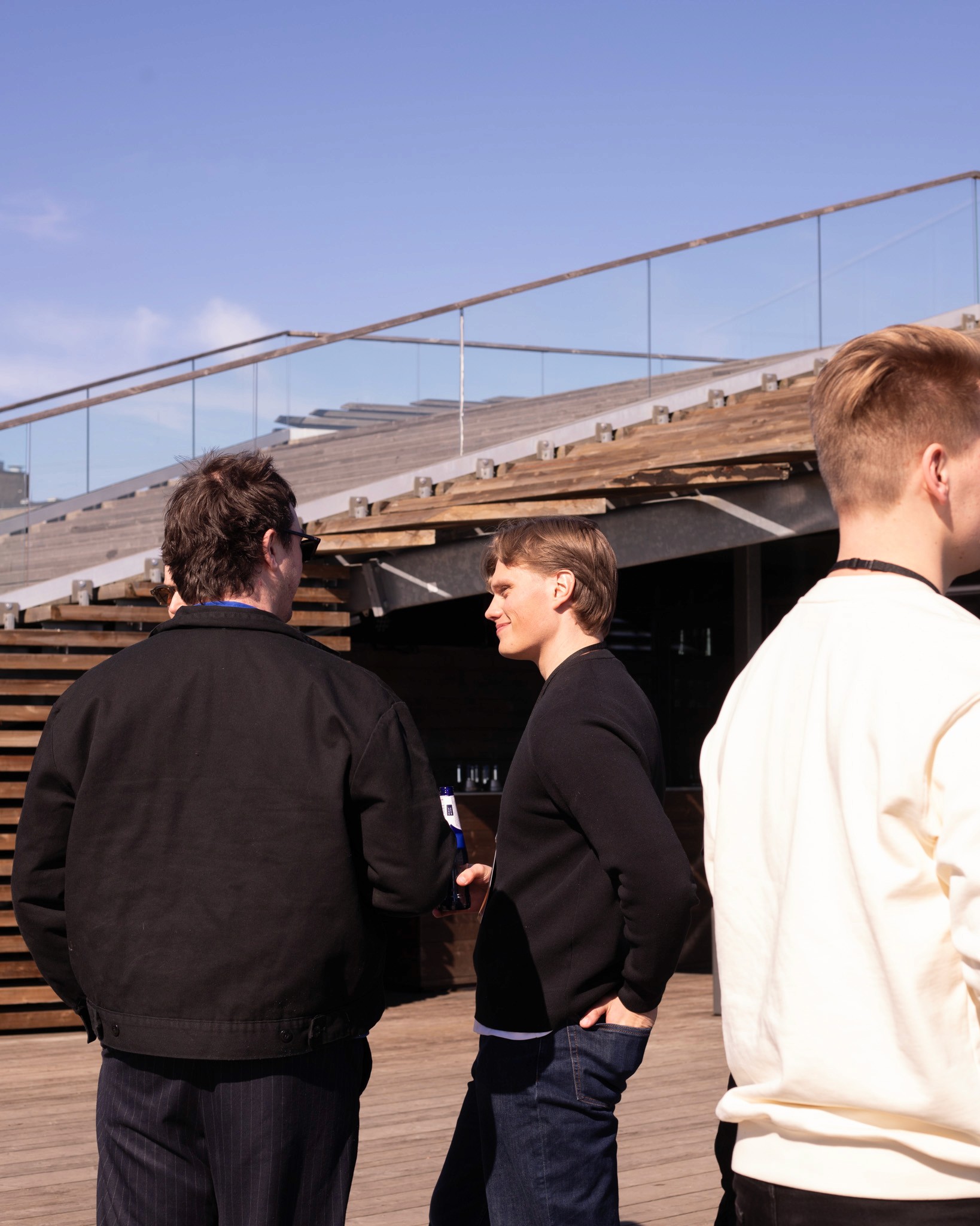Networking on Löyly's terrace with Helsinki's waterfront in the background
