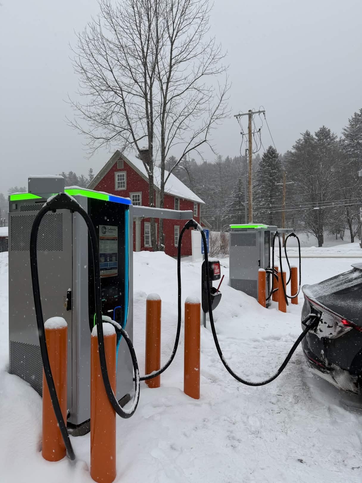 C6AM Charger in front of a pink hotel building