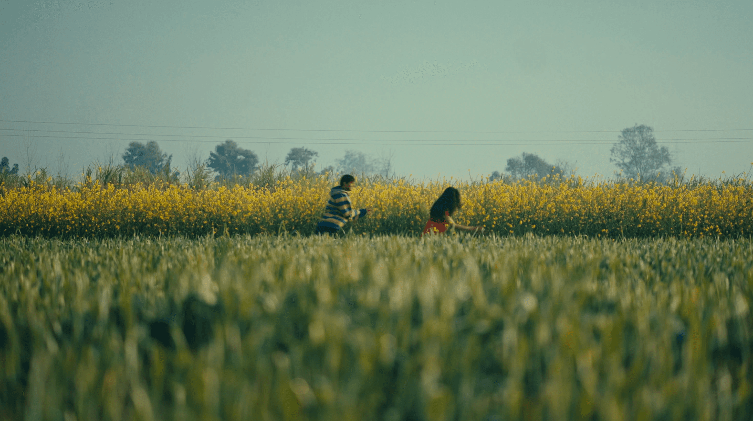 Man silhouetted against a bright orange light