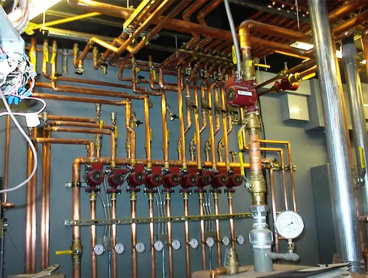 Copper hydronic manifold with nine zone circulator pumps in a Wood River Valley mechanical room