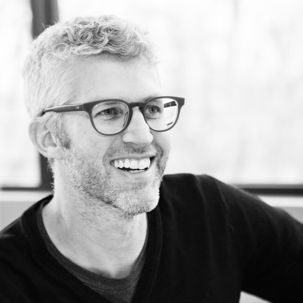 Person pouring Chemical in flask