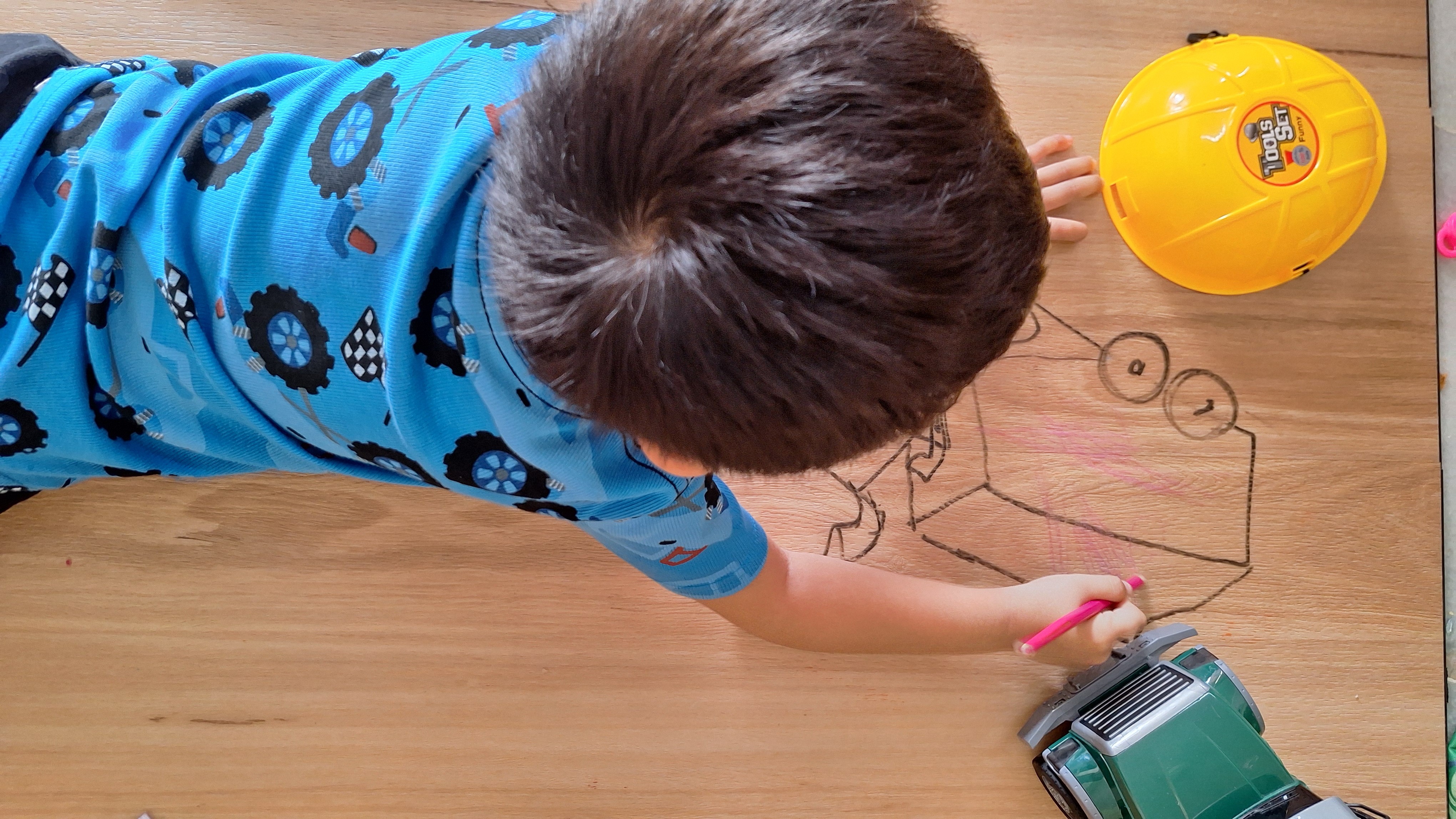 Kids drawing directly on a perfectly level floor in a Brisbane family home — even installation helps floors handle everyday creativity without damage.