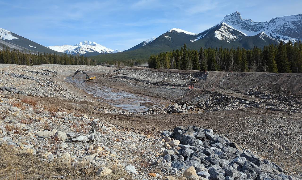 Sediment trap re-excavation work on steep mountainous Evan Thomas Creek during low-flow period