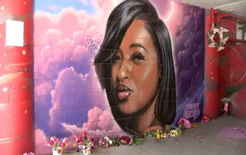 a black and white living room with a large tv