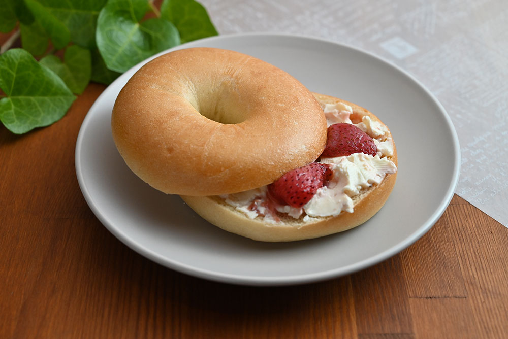 Bagel with cream cheese and strawberries