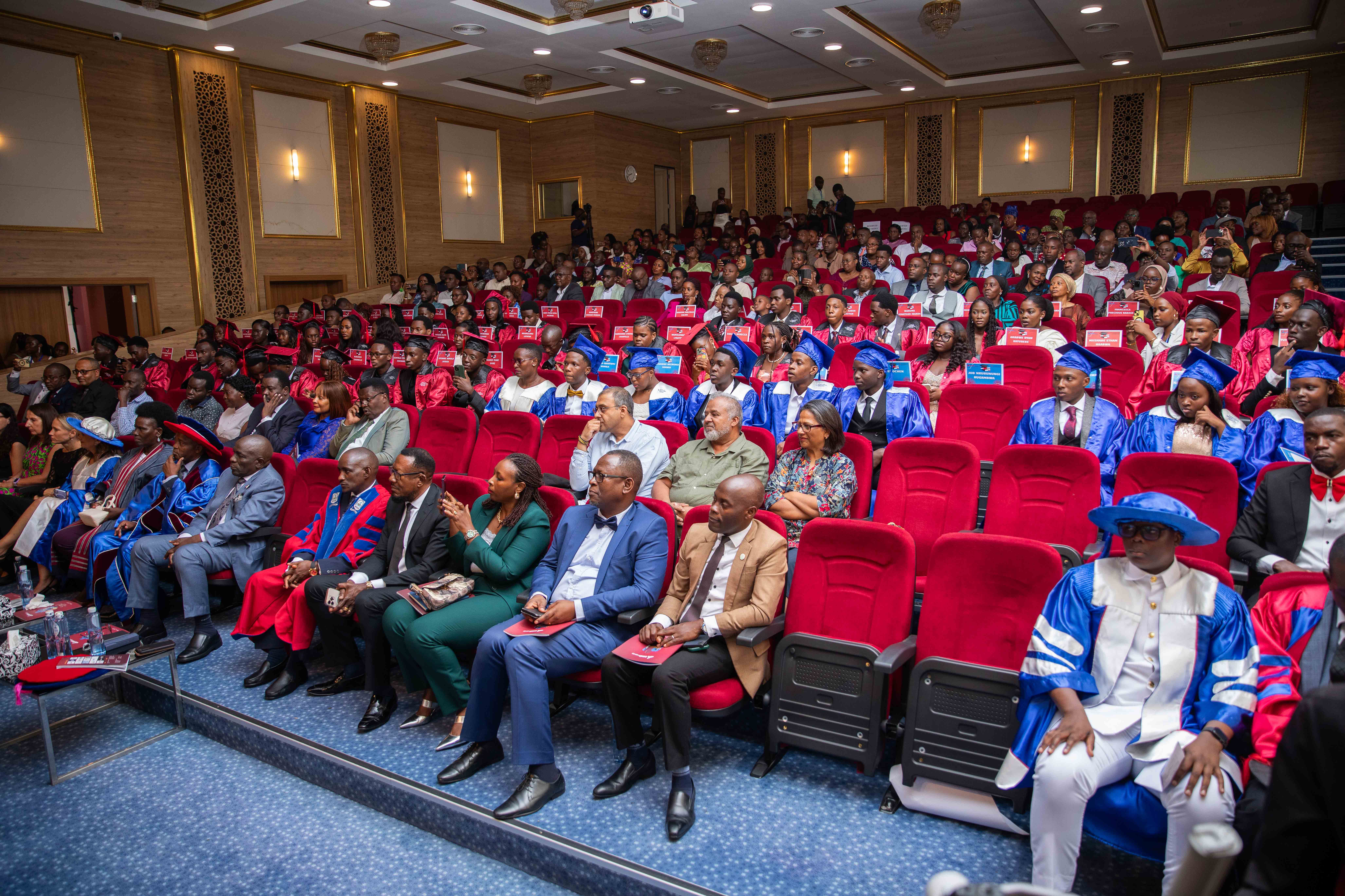 A mother and her daughter are working together on a laptop, focusing on homework