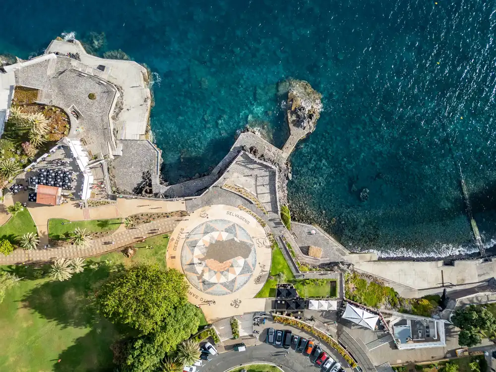a large stone sculpture with Great Sphinx of Giza in the background
