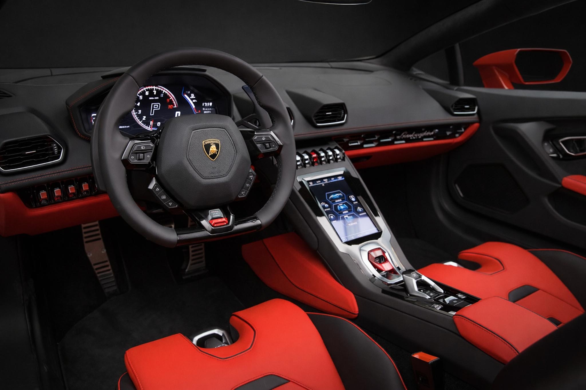 Luxury interior of Lamborghini Huracán EVO Spyder with red leather and carbon details