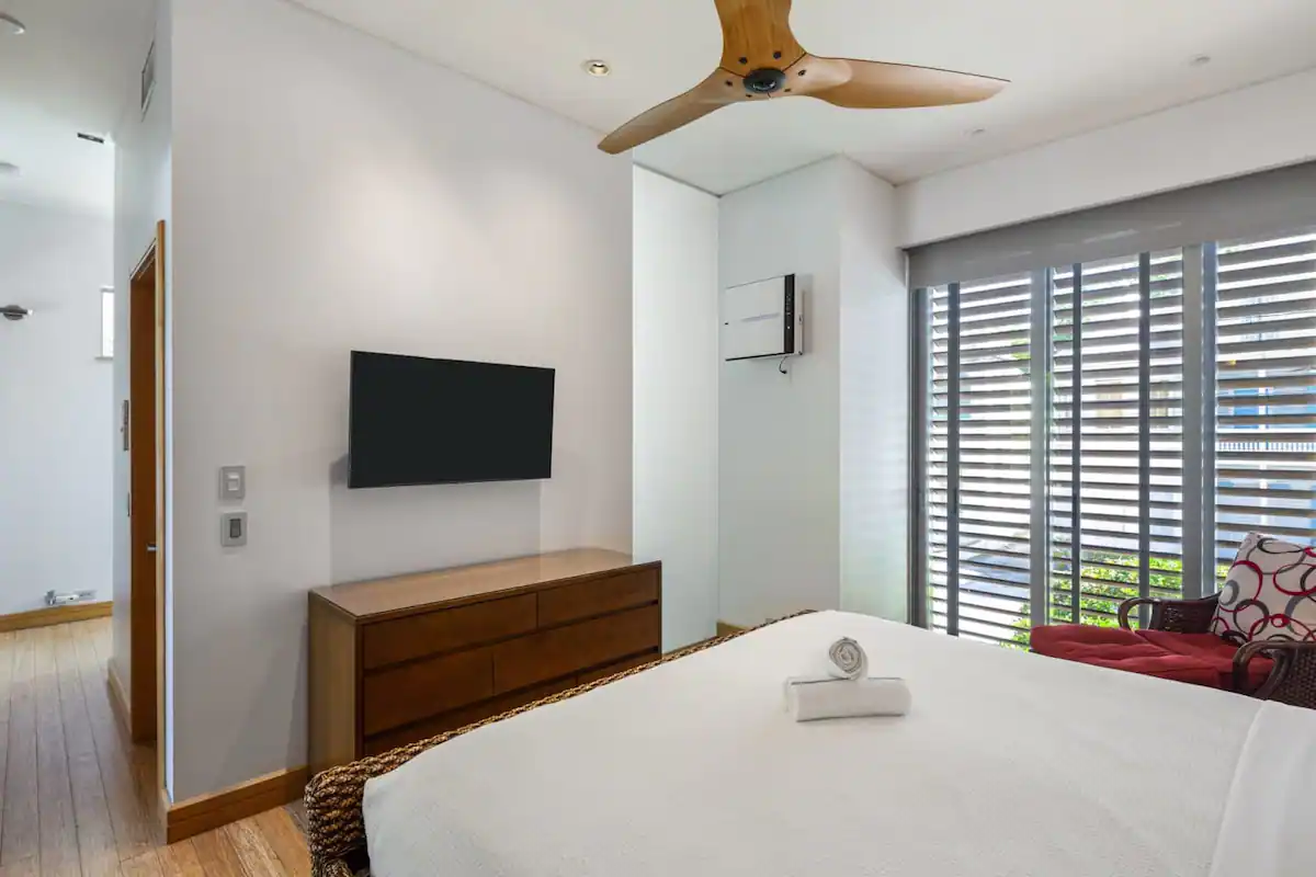 bedroom with minimalist decor, blending style and comfort in contemporary Key West lodging