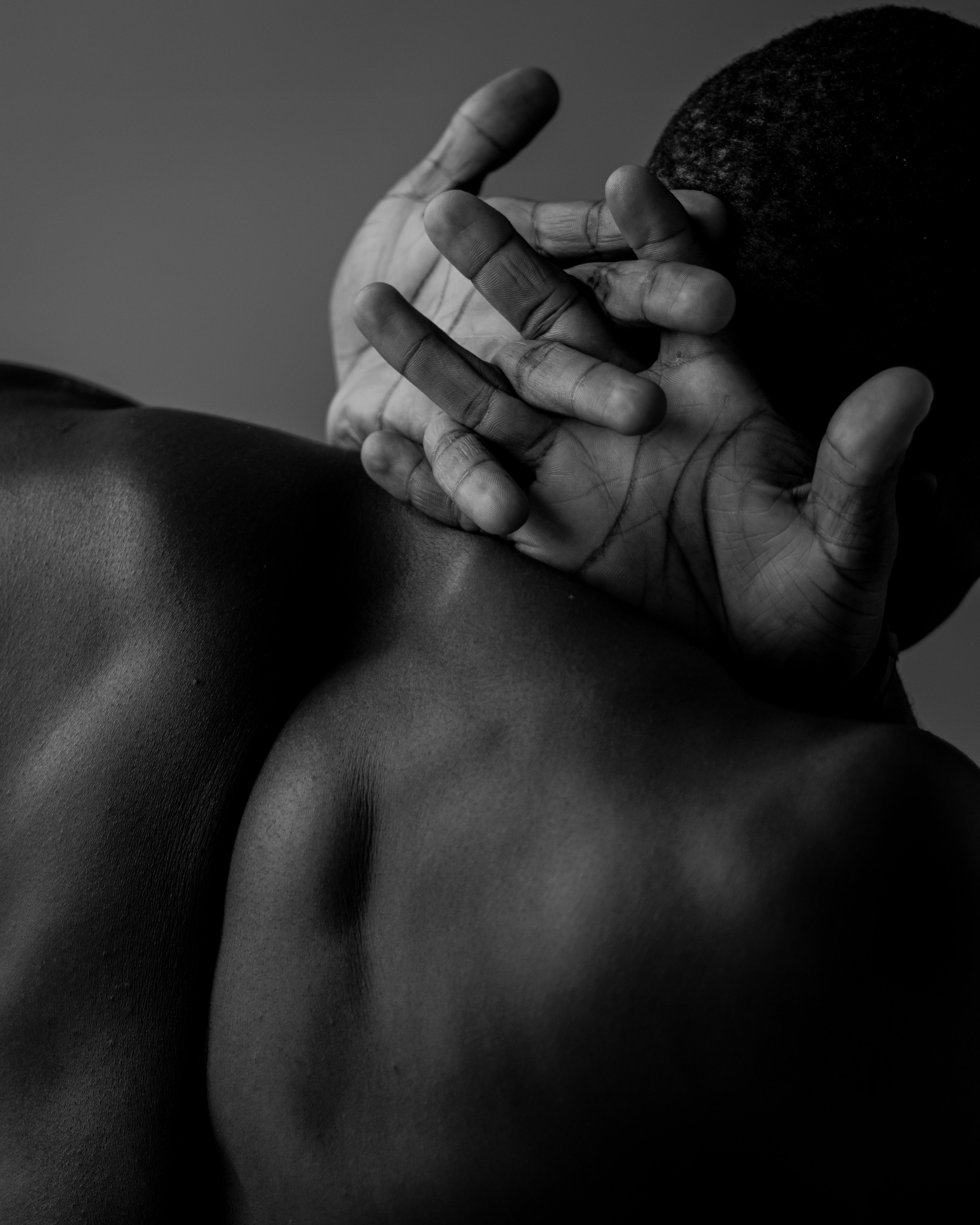 a man with his hands on his back