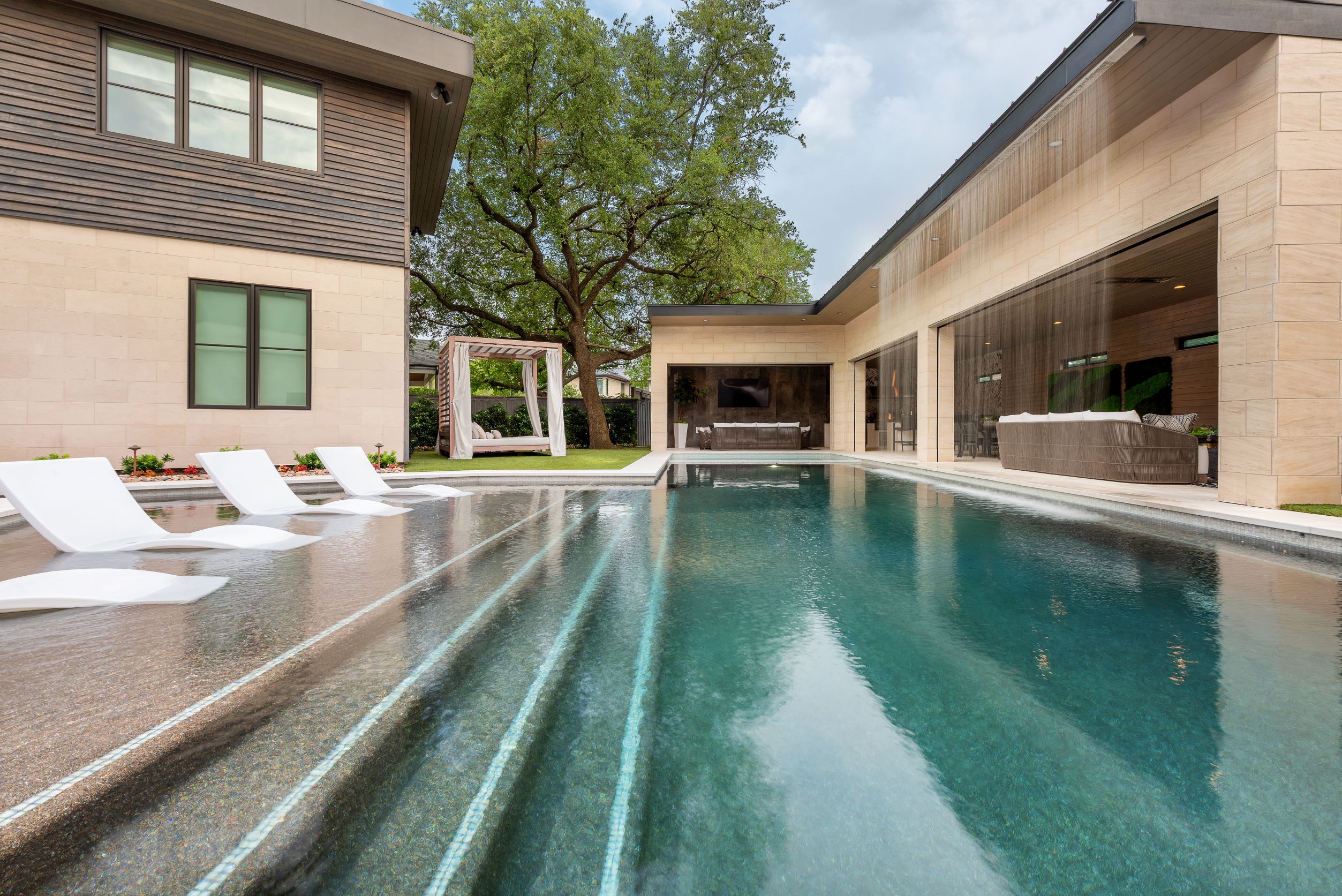 Lanscape Design and Build Project featuring pool and water curtain by Landscape Designer in Plano Tx