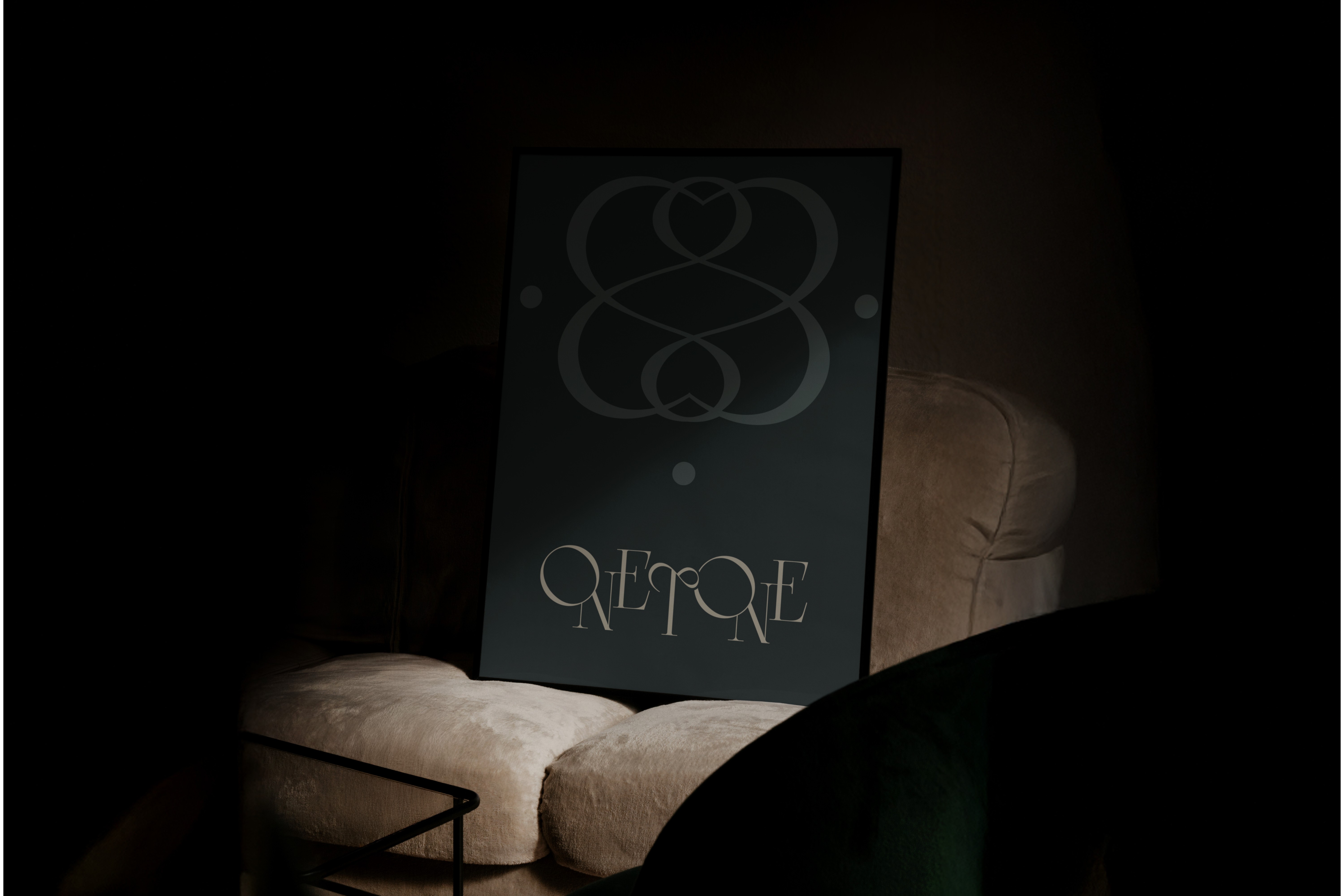 Luxury fashion branding poster – Onetone’s intricate logo design in a dark, moody setting, showcasing the brand’s refined identity for high-end Abaya fashion.