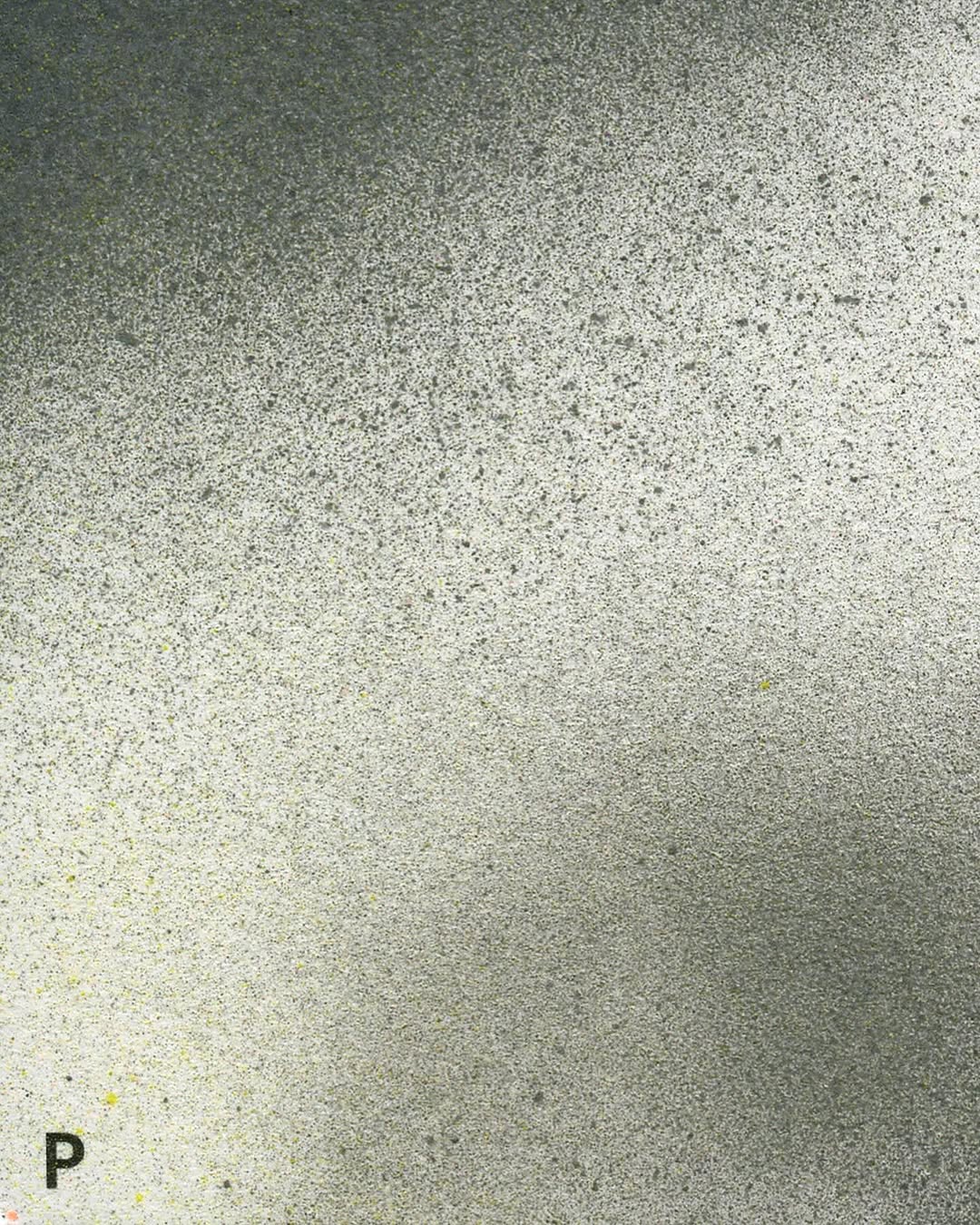 Snow covered trees on a frozen lake at sunrise