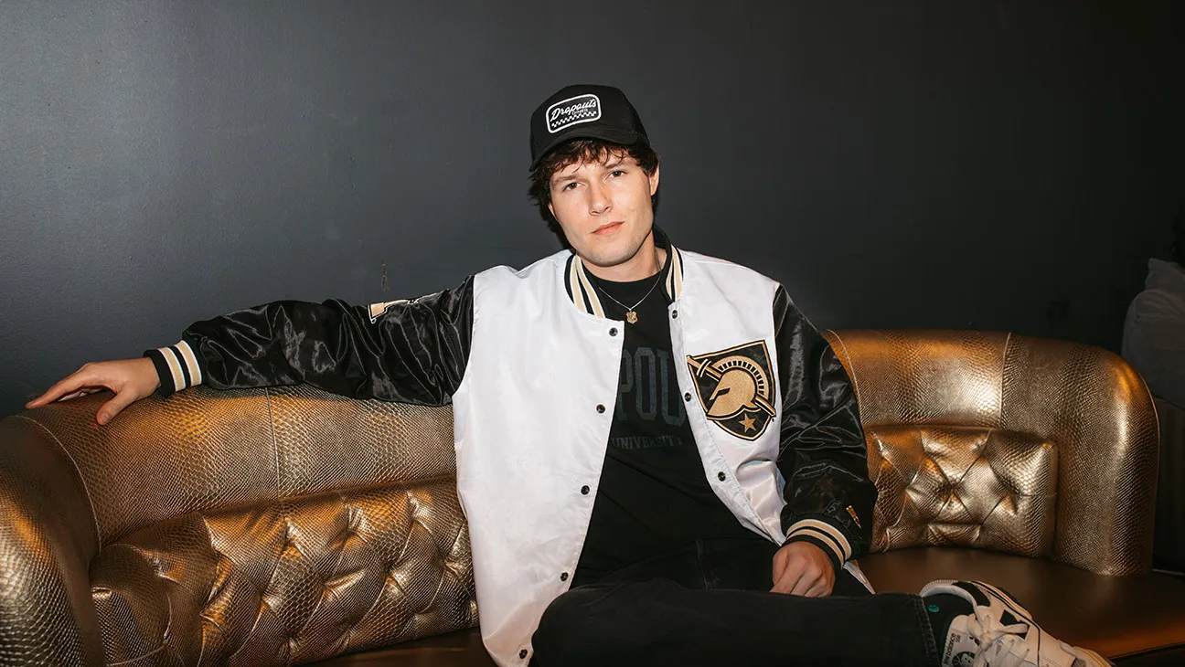 headshot of male in dark background