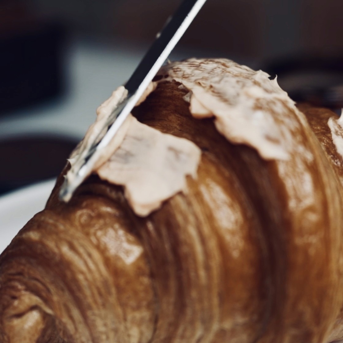 Bold editorial fashion portrait of model in houndstooth blazer with red tie and green shirt against bright turquoise background - Serif Creative Studio luxury fashion photography