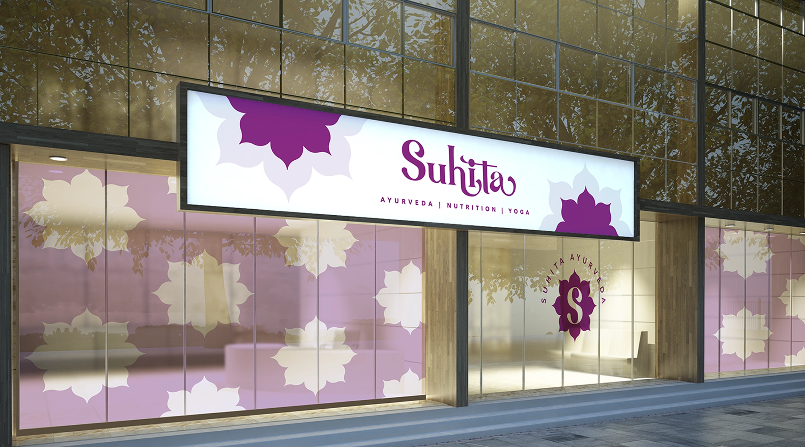 Ayurveda clinic storefront branding featuring Suhita Ayurveda signage and window graphics