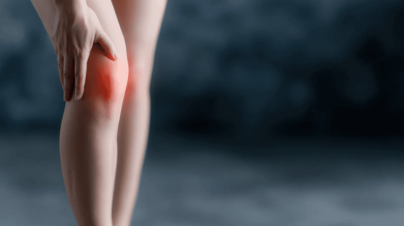 person holding black knit cap