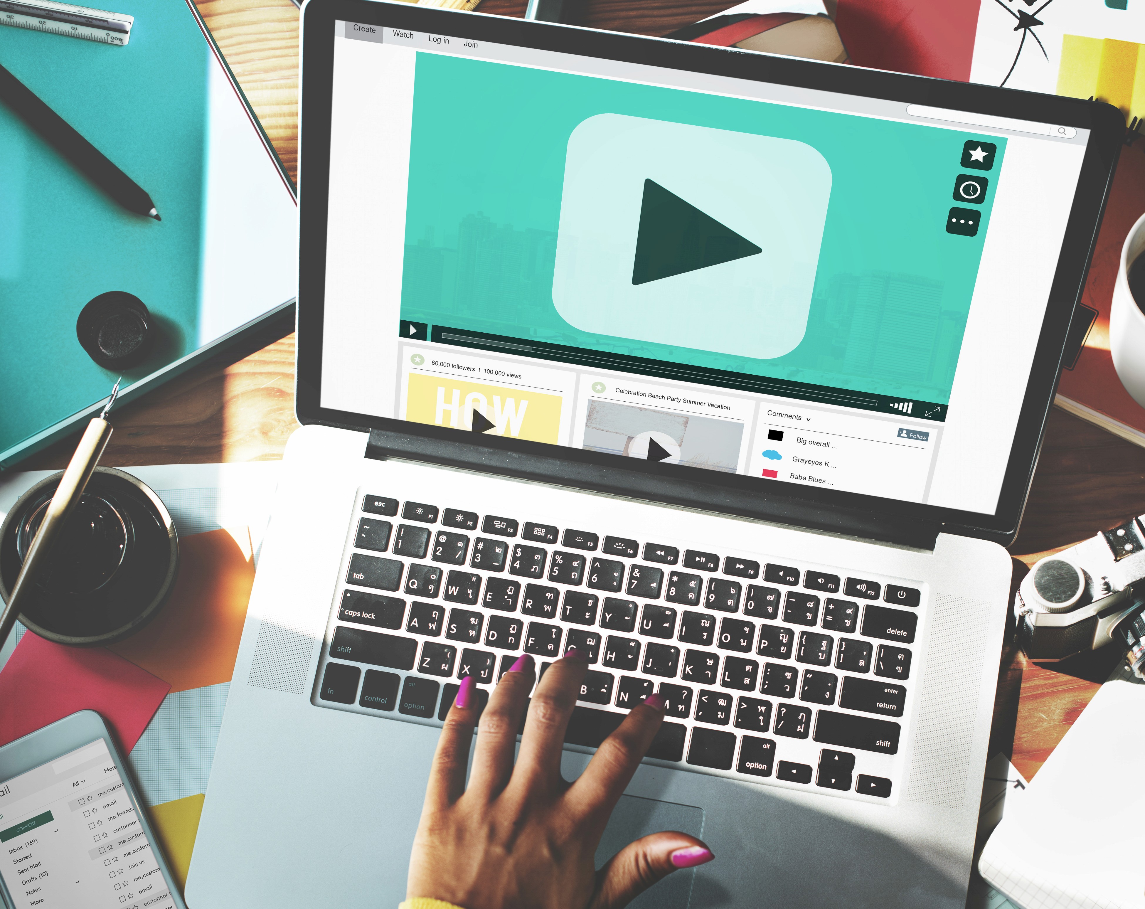 Person selecting or designing a YouTube video thumbnail on a laptop screen, focusing on choosing an eye-catching image and bold text for better click-through rates.