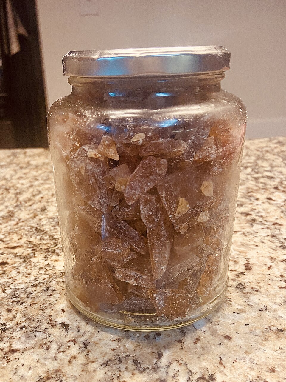 Fresh wild greens and berries in a wooden bowl, representing the hands-on results of Foraging Academy’s certification classes.