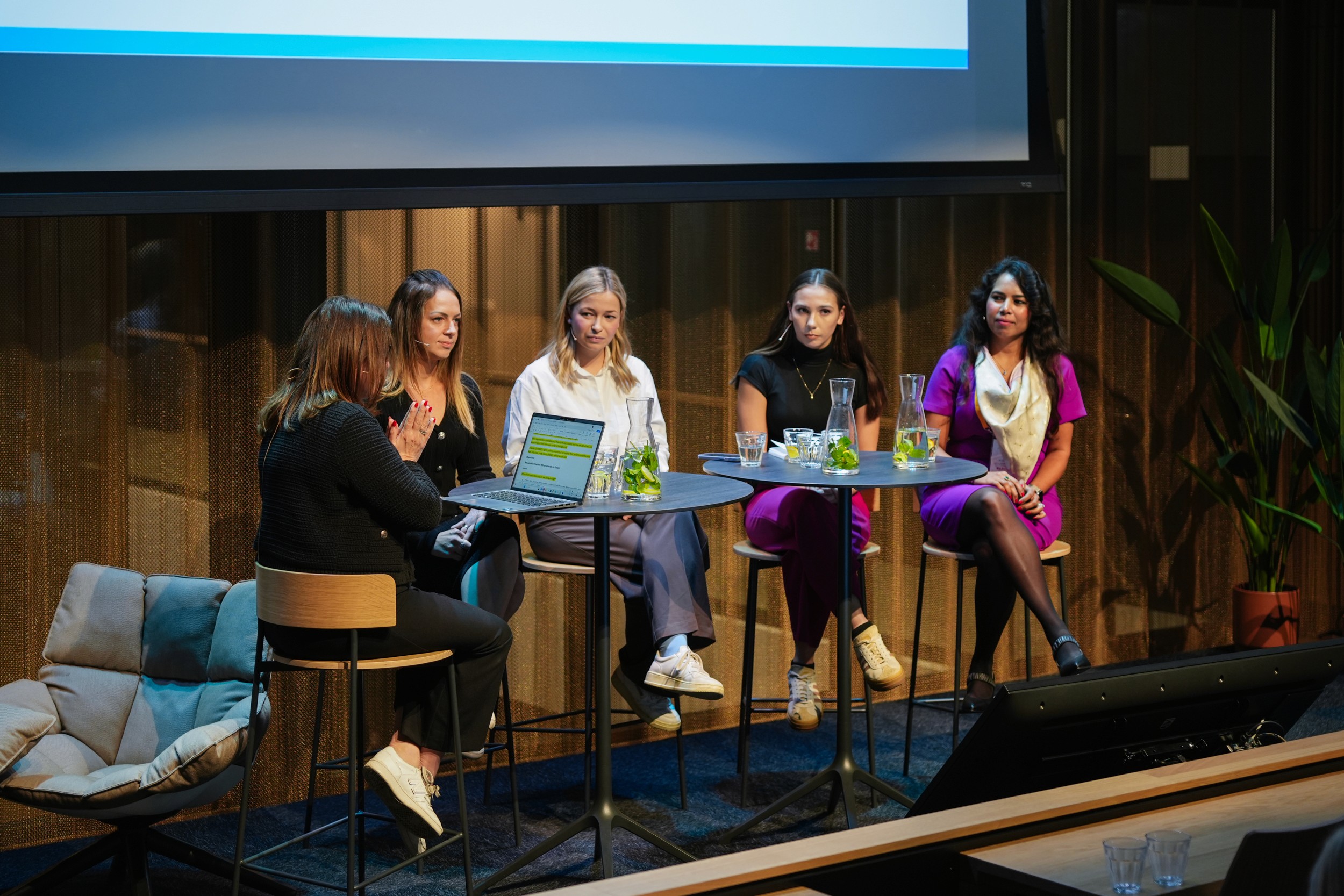 Team talking with each other at office