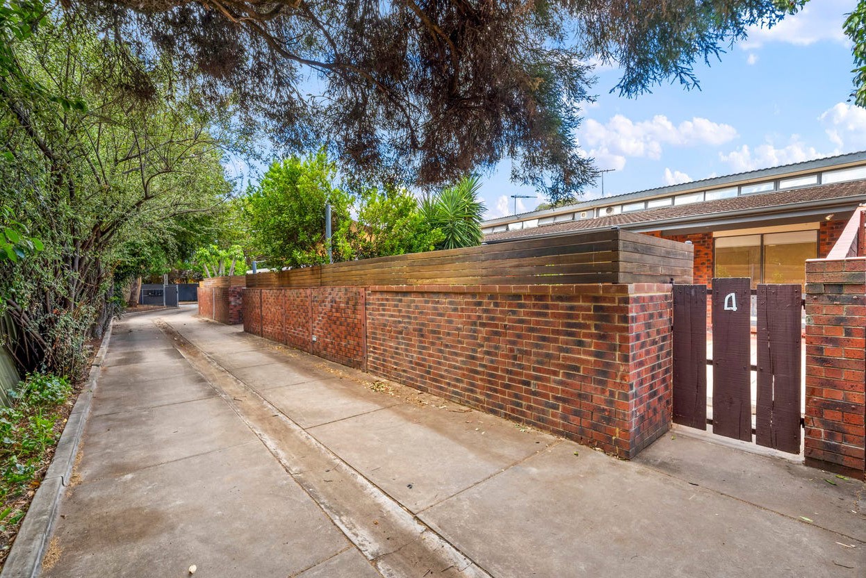 white concrete building beside road during daytime
