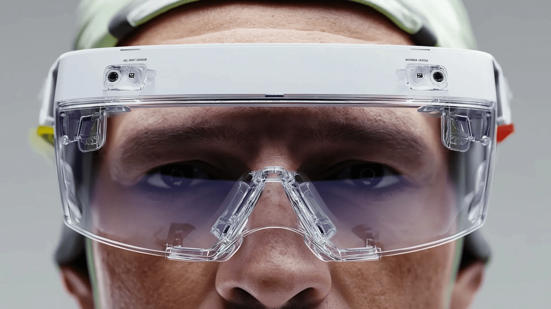 Close up of technician wearing clear safety goggles and hard hat