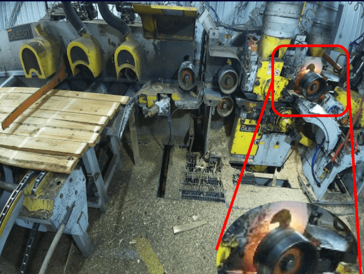A fire starts behind an outfeed roller on a Gilbert planer
