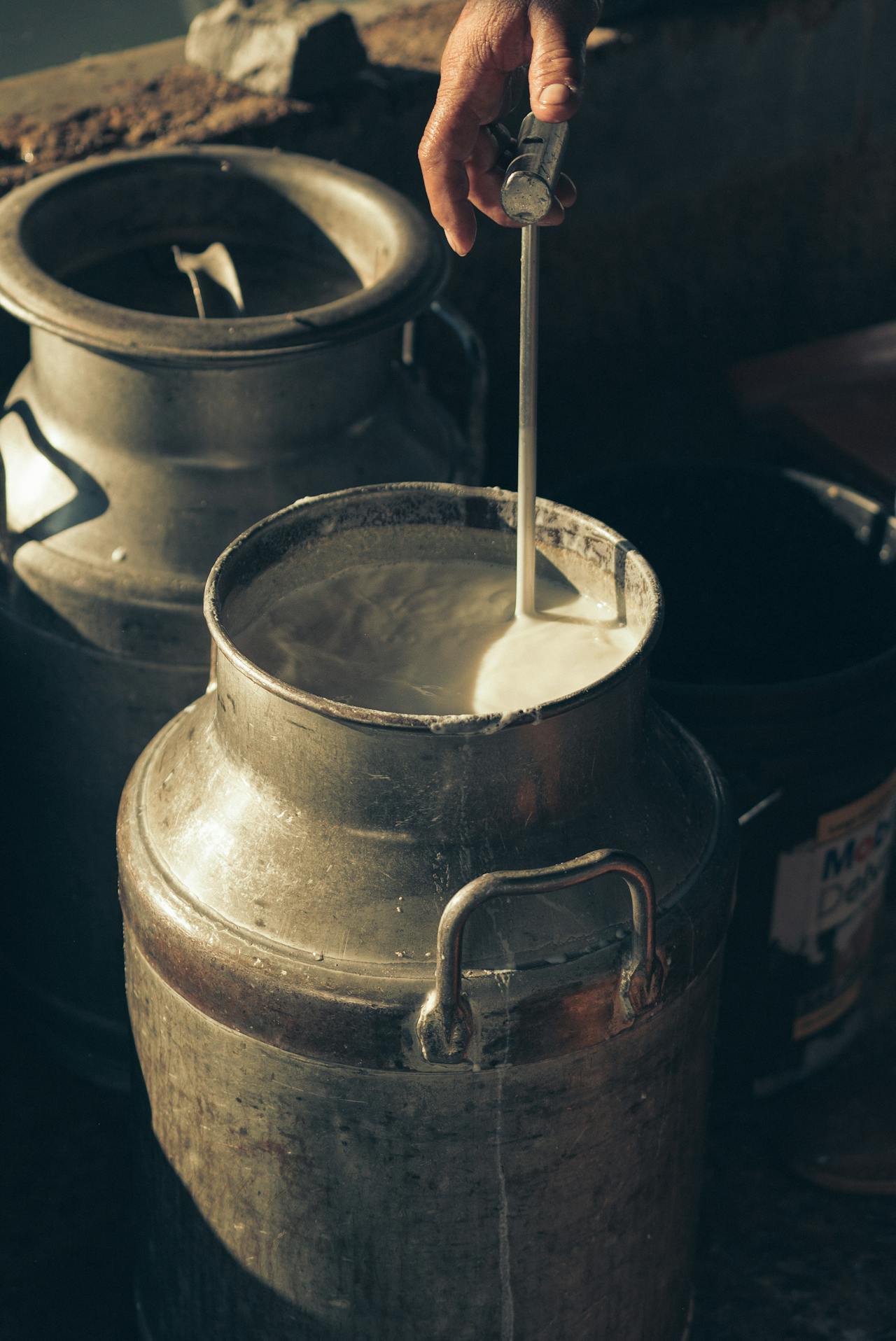 A jar of milk being filled