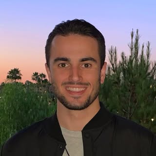 man focus photography of man in green collared top